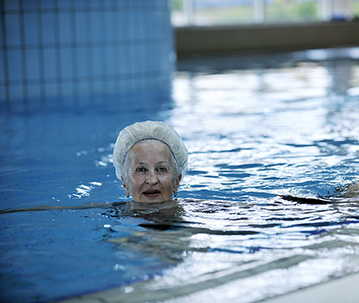 An older woman swimming