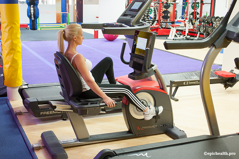 A woman on an exercise bike