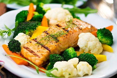 A plate of healthy fish and vegetables