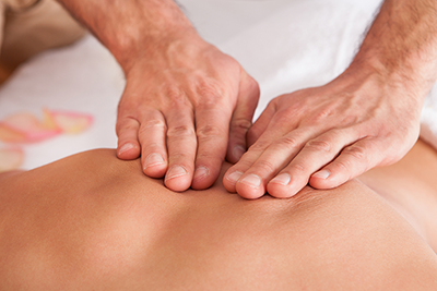 A masseur gives a massage