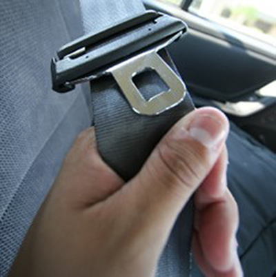 A seatbelt being pulled